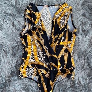 black and gold bodysuit